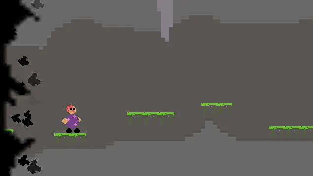 A clown stands on a platform as darkness approaches form the left of the screen.